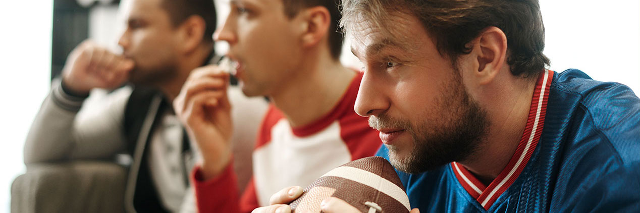Guys watching a football game