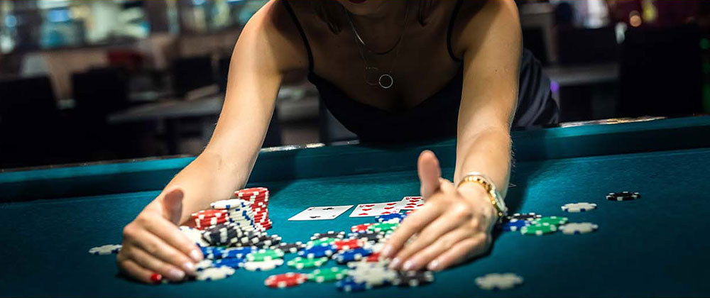 Photo of woman collecting her chips after winning